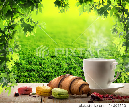 White cup and macaroons 34804520