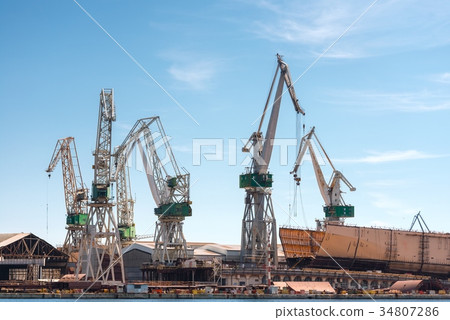 Industrial cargo cranes in the dock 34807286