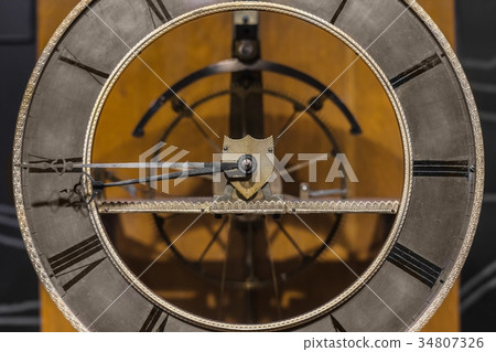 Old clock closeup made out of steel 34807326