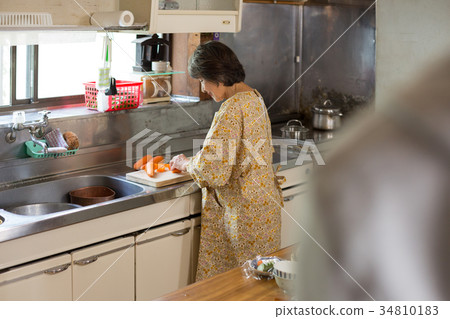 Grandmother preparing food 34810183