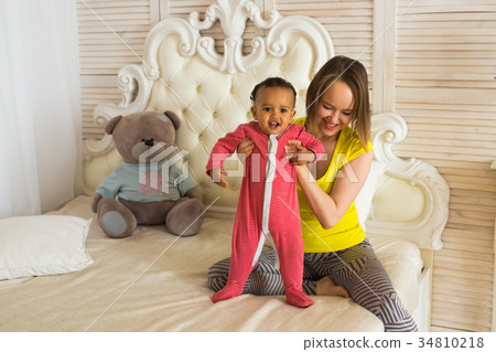 Mother And Mixed Race Baby Playing At Home Mother And Mixed Race Baby Playing At Home 34810218