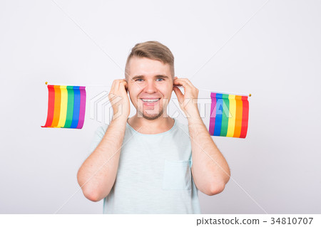 Young man hold a rainbow flag, gey boy. Concept of 34810707