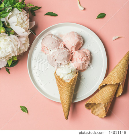 Strawberry and coconut ice cream, cones, white 34811146