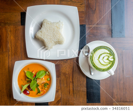 Thai curry soup with rice and hot green tea 34816051