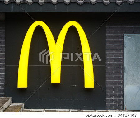 McDonald Restaurant logo on the dark wall 34817408