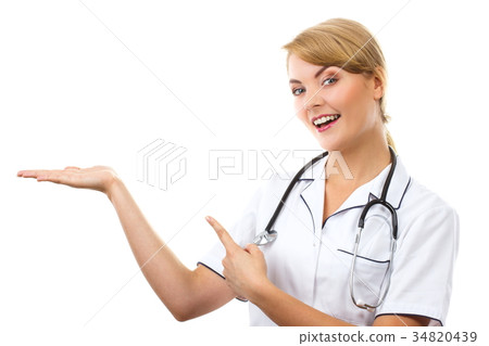 Woman doctor with stethoscope showing empty hand Woman doctor with stethoscope showing empty hand 34820439