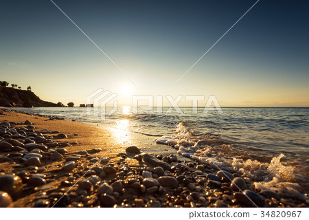 Colorful ocean beach sunrise. 34820967