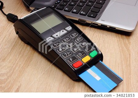 Payment terminal with credit card and laptop 34821853