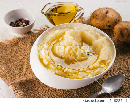 Mashed potatoes on white concrete background Mashed potatoes on white concrete background 34822544