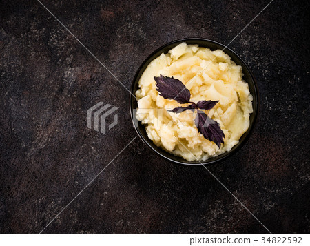 Mashed potatoes on dark concrete background Mashed potatoes on dark concrete background 34822592