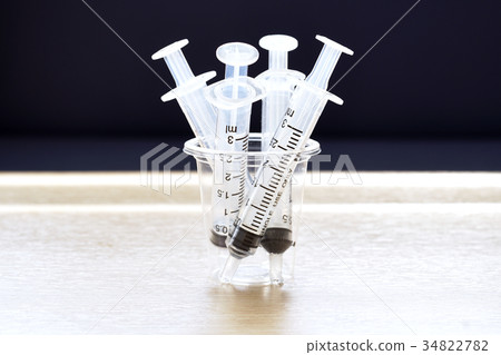 syringes in cup syringes in cup 34822782