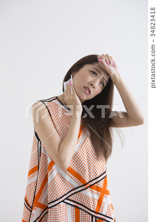 Woman using sweat wipe sheet 34823418