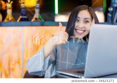 Female using laptop 34825271