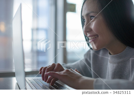 Female using laptop Female using laptop 34825311