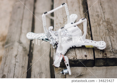 Crashed drone on the ground 34825427