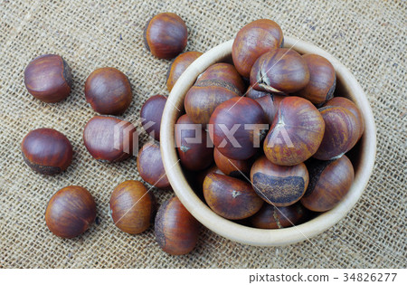 Chestnuts in bowl with top view. 34826277