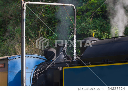 Steam train. Nilgiri mountain railway. Water 34827324