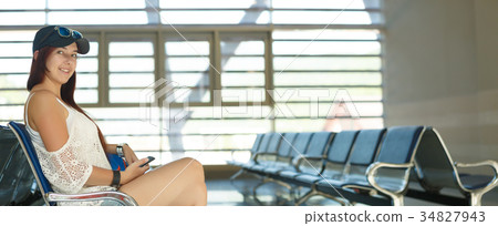 Image of girl in waiting room at airport Image of girl in waiting room at airport 34827943