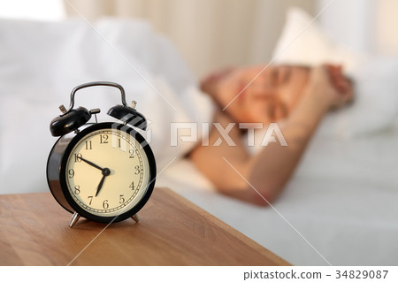 Beautiful young woman sleeping and smiling while Beautiful young woman sleeping and smiling while 34829087