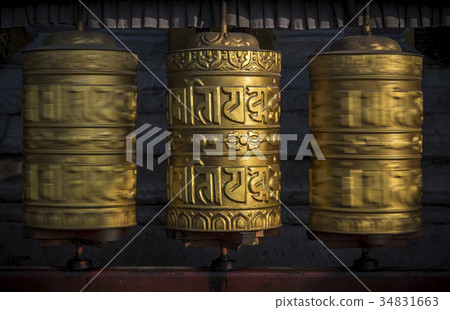Buddhist shiny prayer wheels in motion 34831663