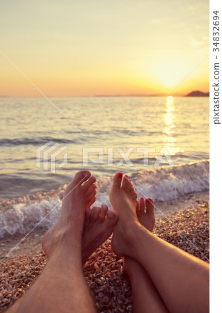 Couple lying on the beach 34832694