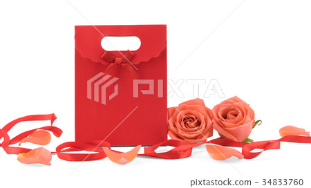 Red gift bag decorated with orange roses Red gift bag decorated with orange roses 34833760