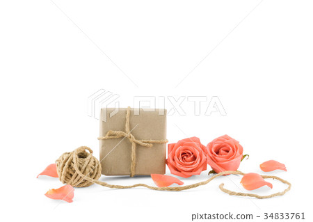 Brown gift boxes and rope with orange roses Brown gift boxes and rope with orange roses 34833761