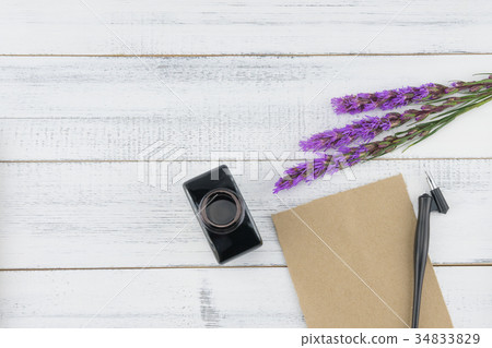 Blank brown card, oblique pen and bottle of ink Blank brown card, oblique pen and bottle of ink 34833829