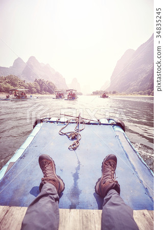 Relax on the Li River bamboo raft, China. 34835245
