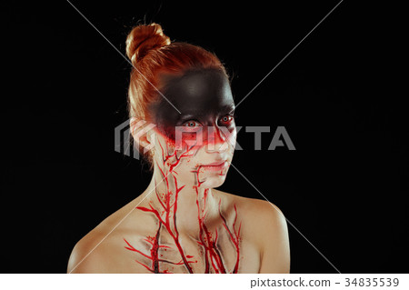 Mystic bloody girl with blood on her face 34835539