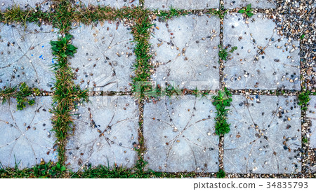 Tile in the city with small stones and grass 34835793