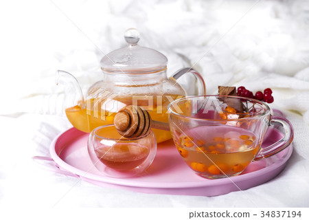 A cup of tea with sea buckthorn and herbs A cup of tea with sea buckthorn and herbs 34837194