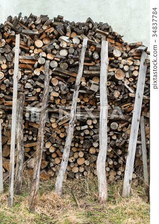 A pile of stacked firewood. Preparation to winter A pile of stacked firewood. Preparation to winter 34837784