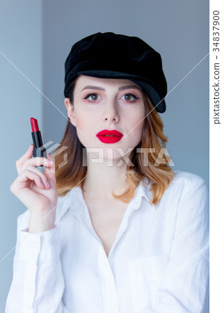 redhead woman in hat with lipstick for makeup 34837900