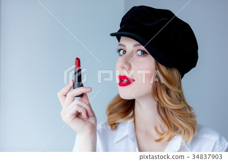 redhead woman in hat with lipstick for makeup 34837903