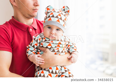 Adorable Caucasian baby and his father. Portrait 34838015