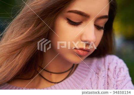 Face of happy beautiful woman with flying hair Face of happy beautiful woman with flying hair 34838134