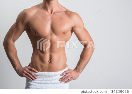 Charming guy is demonstrating perfect torso 34839026