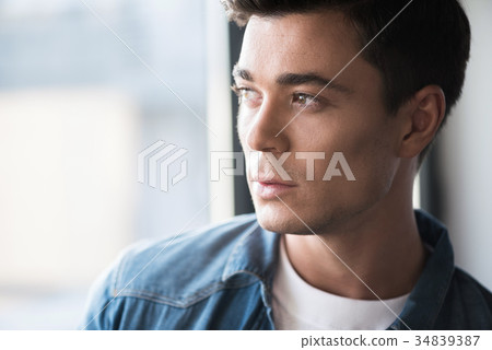 Pleasant stylish guy is thinking pensively 34839387