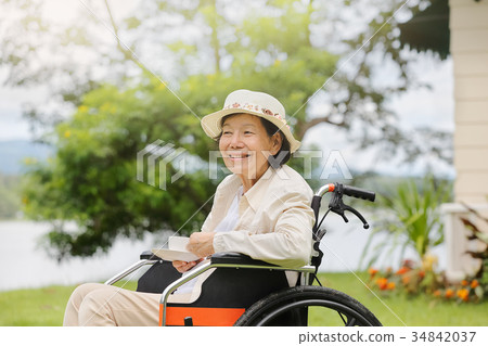 elderly woman relax in backyard 34842037