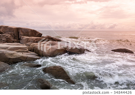 The sea waves rolling on stones 34844426