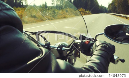 Motorcyclist on the road tripping 34848973