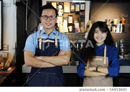 Portrait of smiling asian barista team Portrait of smiling asian barista team 34853693