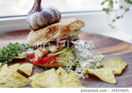 Creatively styled beef burger rustic home made Creatively styled beef burger rustic home made 34854005