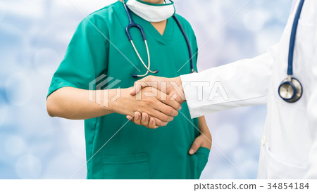 Doctors shaking hands. Medical people teamwork. Doctors shaking hands. Medical people teamwork. 34854184