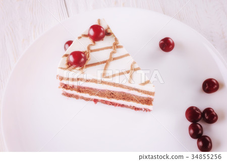 Chocolate cake with mousse, decorated cherries 34855256