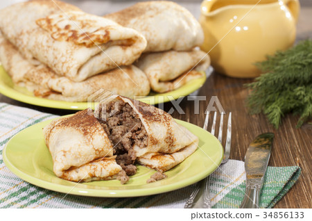 Pancakes with minced meat. 34856133