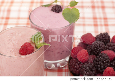Сocktail of  banana with frozen  blackberries  34856230