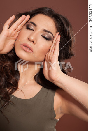 beautiful girl hairstyle curls on a brown 34860366