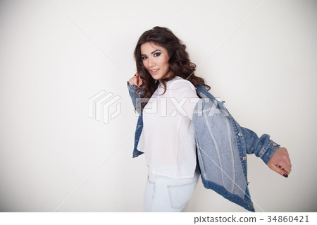 beautiful girl posing on a white background curls 34860421